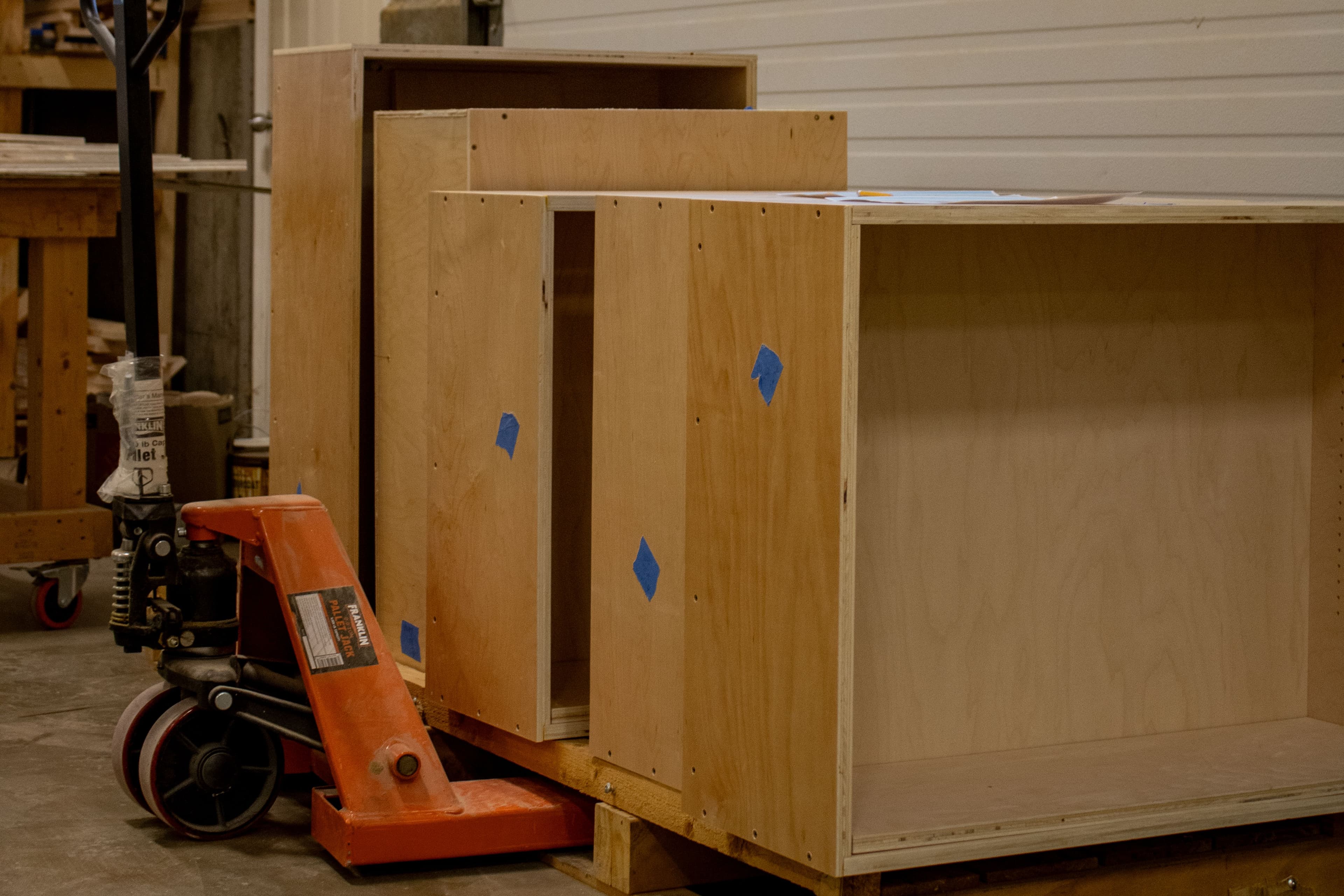 Cabinet carcasses loaded onto a palette in our millwork shop.