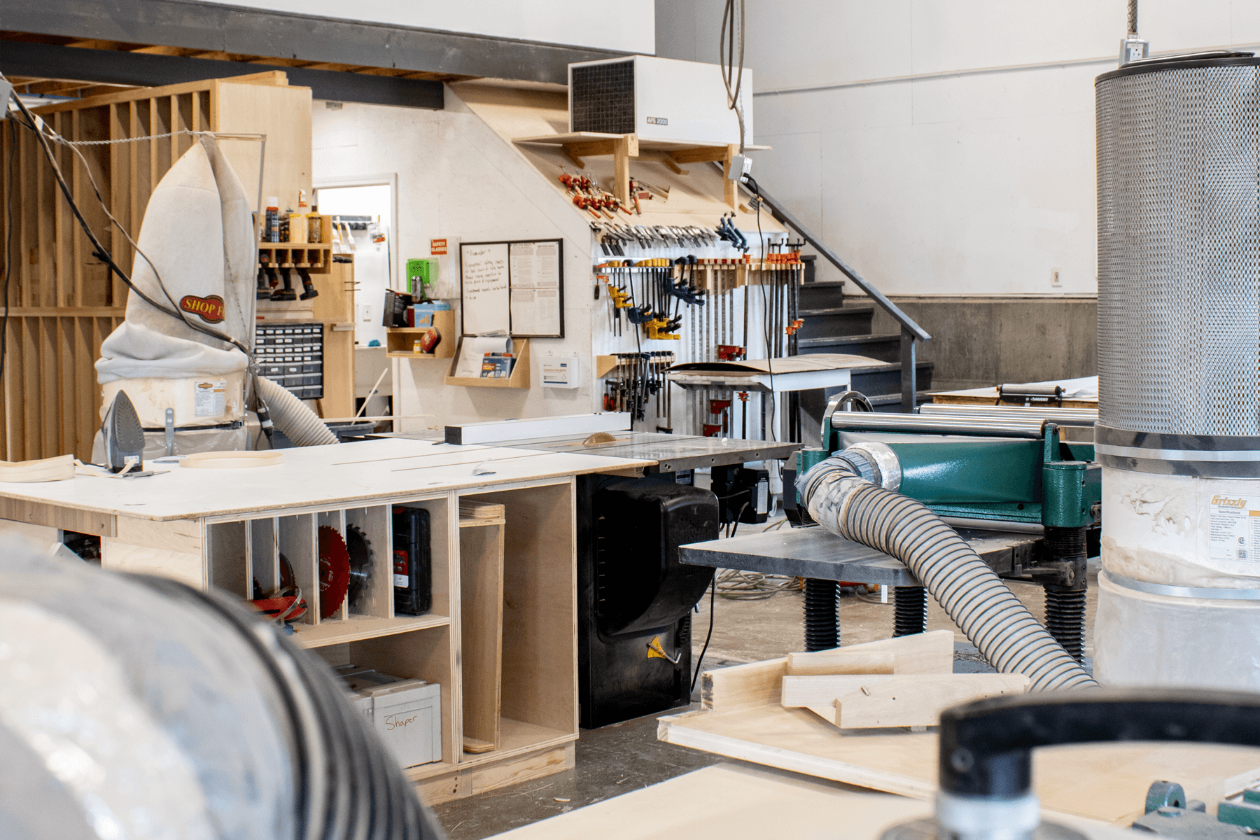 Orion Woodshop craftsman putting finishing touches on a custom millwork piece before adding trim detail and finish.