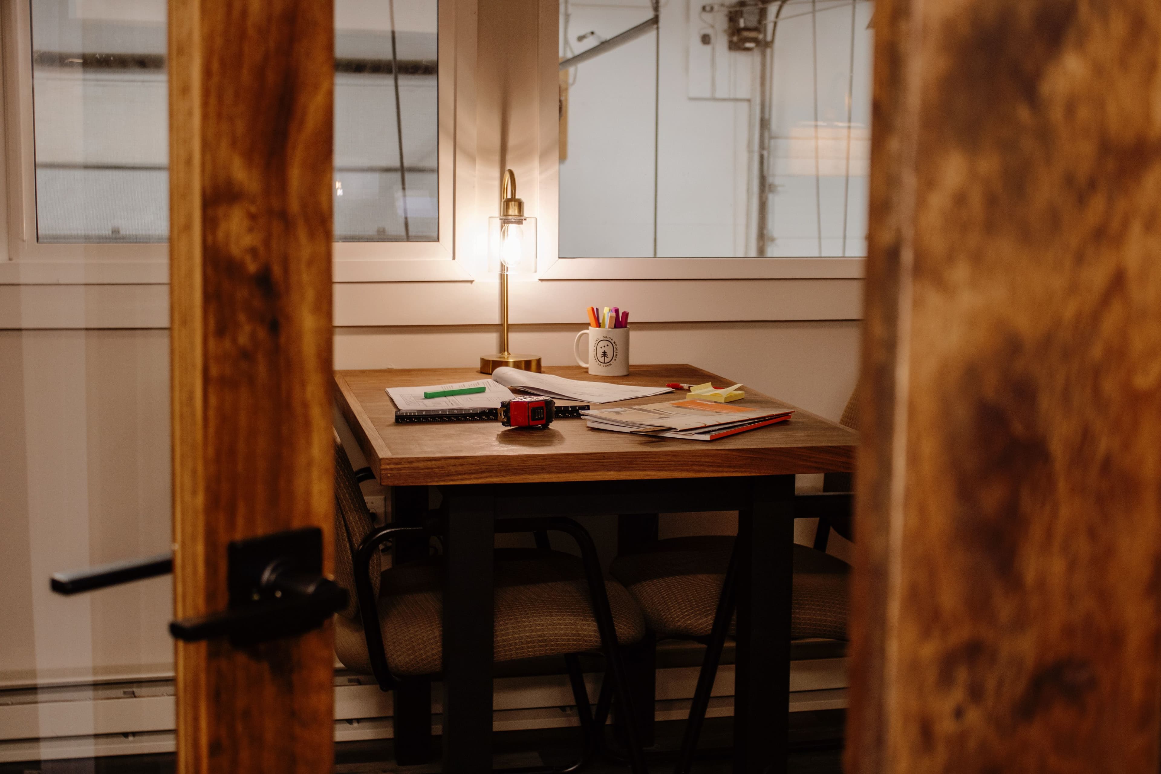 Private office with client meeting area inside the Orion Woodshop office.