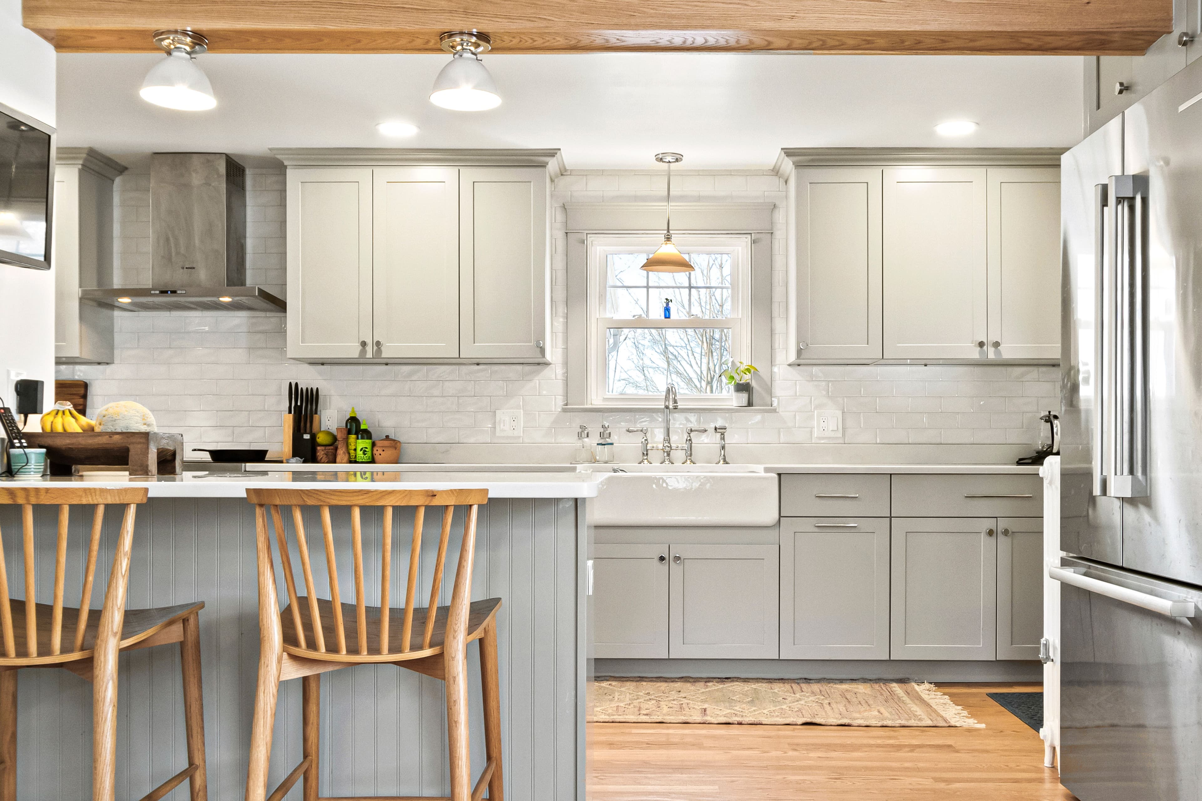 Remodeled kitchen in southern Maine featuring a combination of custom and prefabricated cabinetry.